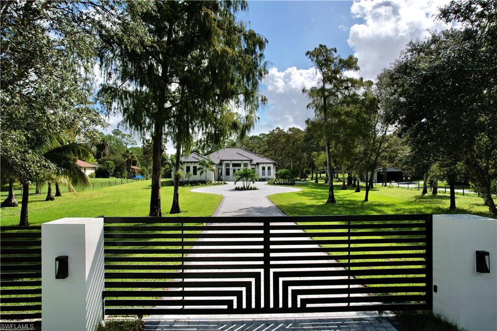 428 21st Street Southwest Naples, FL 34117 - Photo 6 of 45 a view of a park with large trees