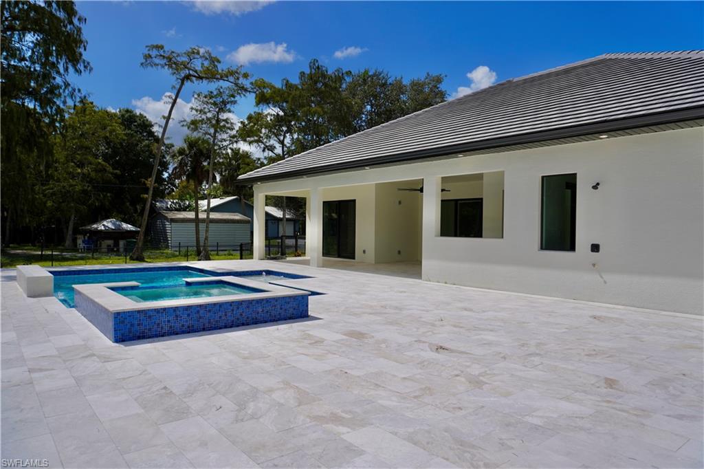 428 21st Street Southwest Naples, FL 34117 - Photo 8 of 45 a house view with a backyard space