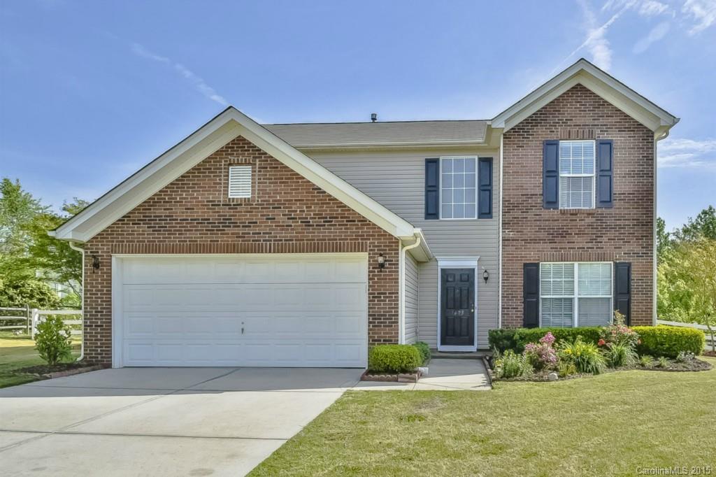 7475 Fallen Timber Lane Tega Cay, SC 29708 - Photo 1 of 24 a front view of a house with garden
