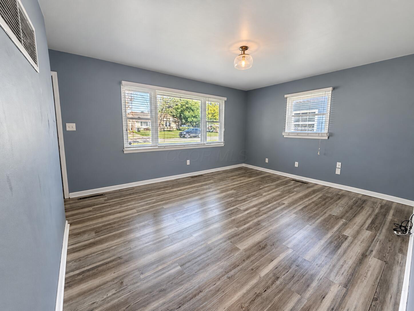1769 Ward Road Columbus, OH 43224 - Photo 3 of 18 Living Room -Bright living space featuring low-maintenance, durable vinyl plank flooring.
