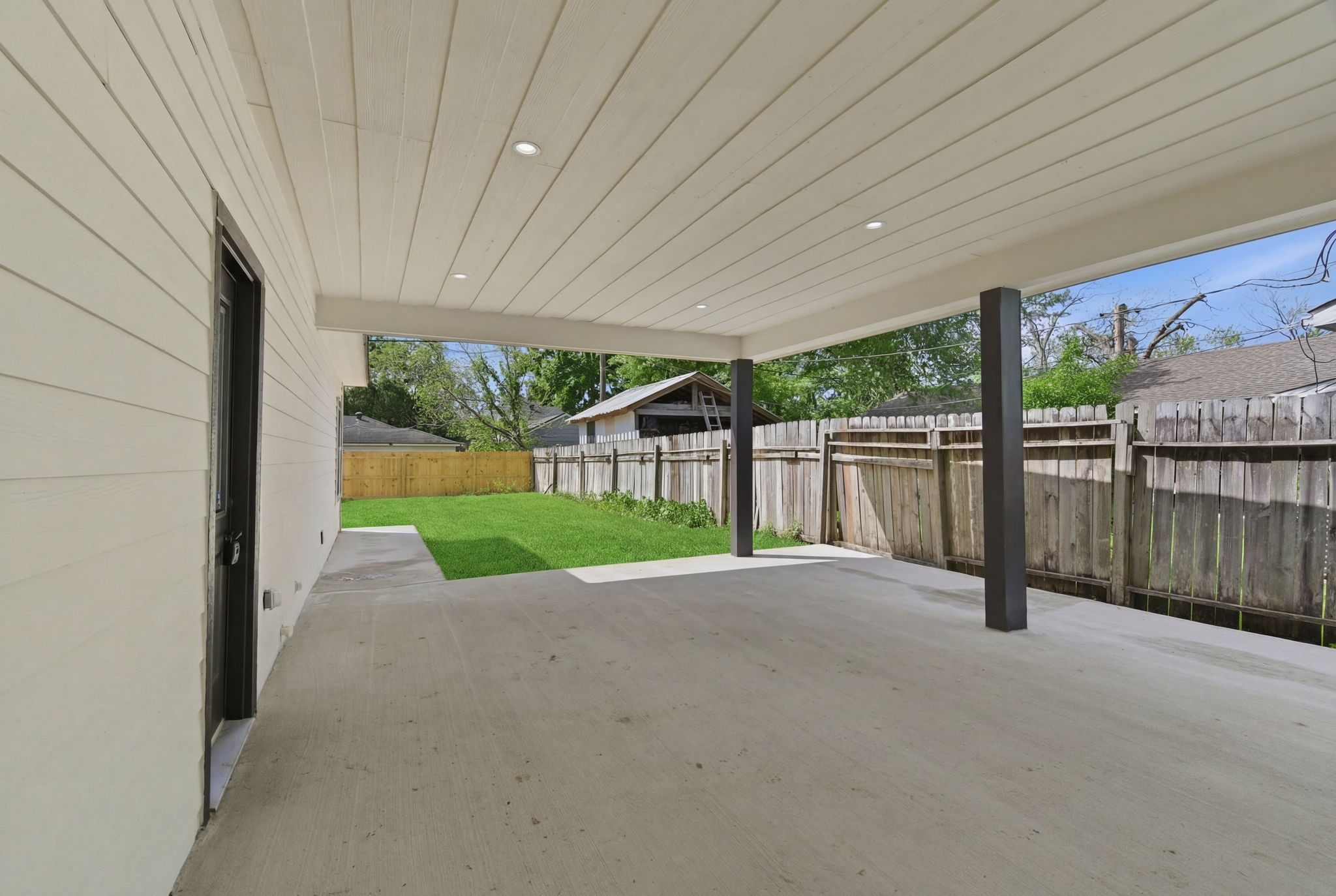 7040 Kinney Street Houston, TX 77087 - Photo 5 of 47 a view of a backyard with wooden fence