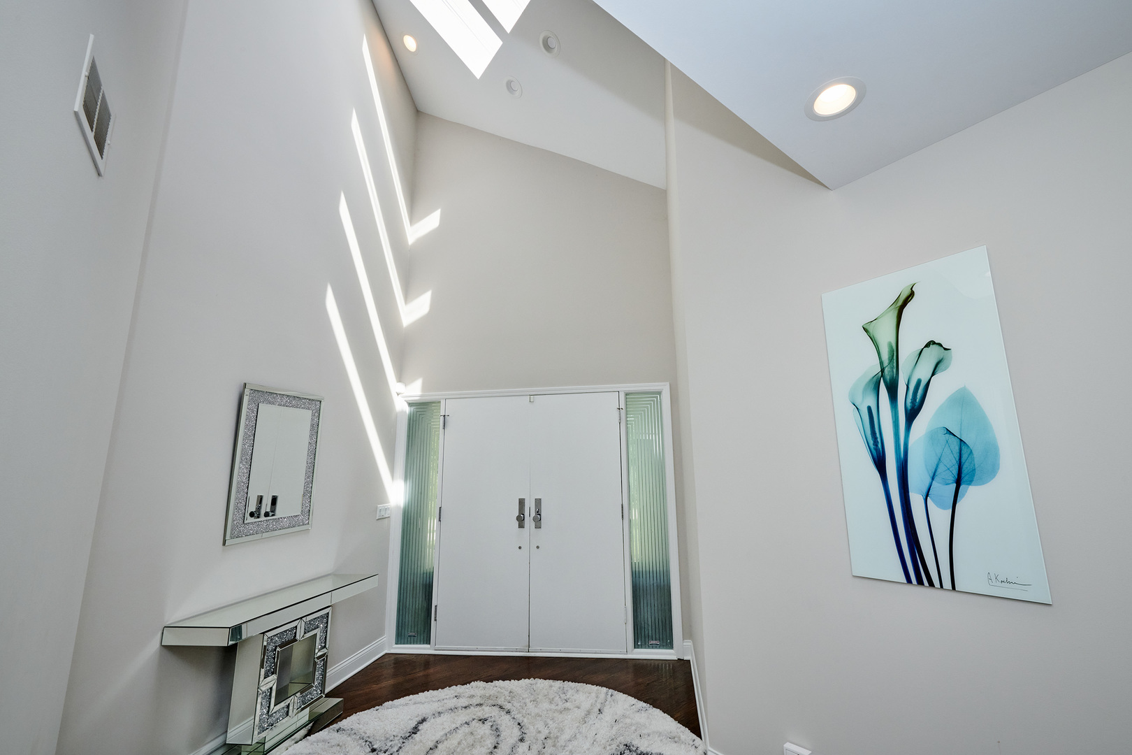 1218 Schaeffer Road Long Grove, IL 60047 - Photo 3 of 42 a hallway with painting and a potted plant