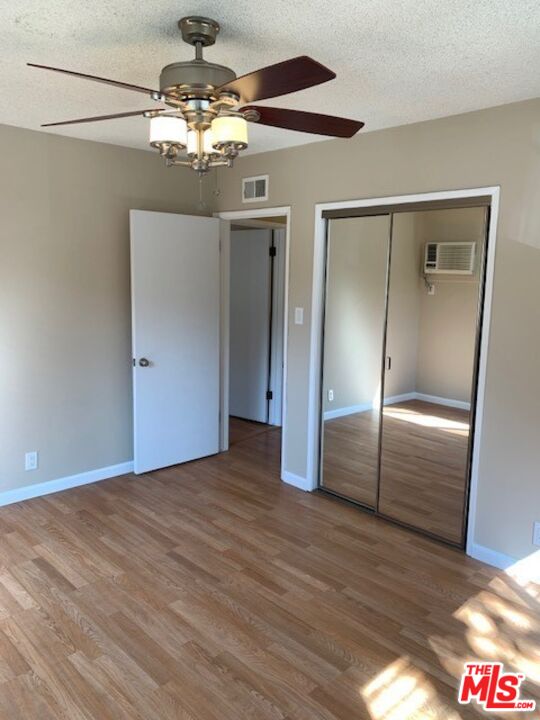 1201 South Sherbourne Drive, Unit 4 Los Angeles, CA 90035 - Photo 11 of 14 a view of a hallway with wooden floor