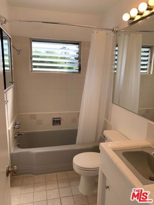 1201 South Sherbourne Drive, Unit 4 Los Angeles, CA 90035 - Photo 14 of 14 a bathroom with a sink a toilet and bathtub