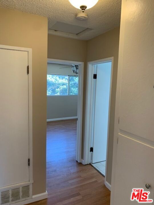 1201 South Sherbourne Drive, Unit 4 Los Angeles, CA 90035 - Photo 8 of 14 a view of an empty room and window