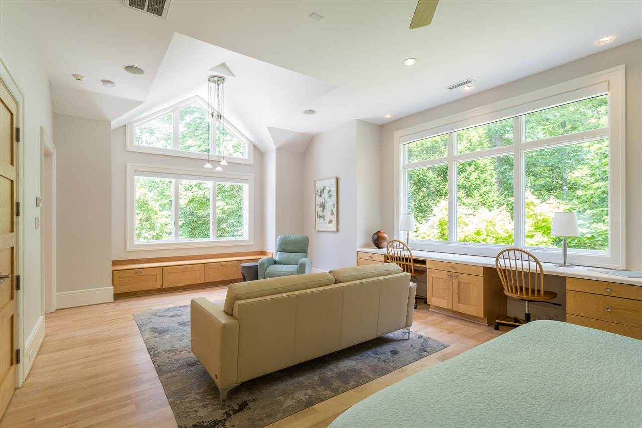 1117 Baslow Brook Court Raleigh, NC 27614 - Photo 24 of 30 Bedroom 4 enjoys the most magnificent scenery through its multiple windows. Additional features include recessed lighting, ceiling fan, contemporary pendant fixture, & automated shades. Its remodeled bath features new flooring & subway tile surround. Versatile Bedroom Four