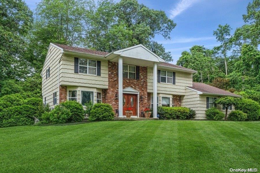 5 Allenby Drive Northport, NY 11768 - Photo 1 of 1 a front view of a house with a yard
