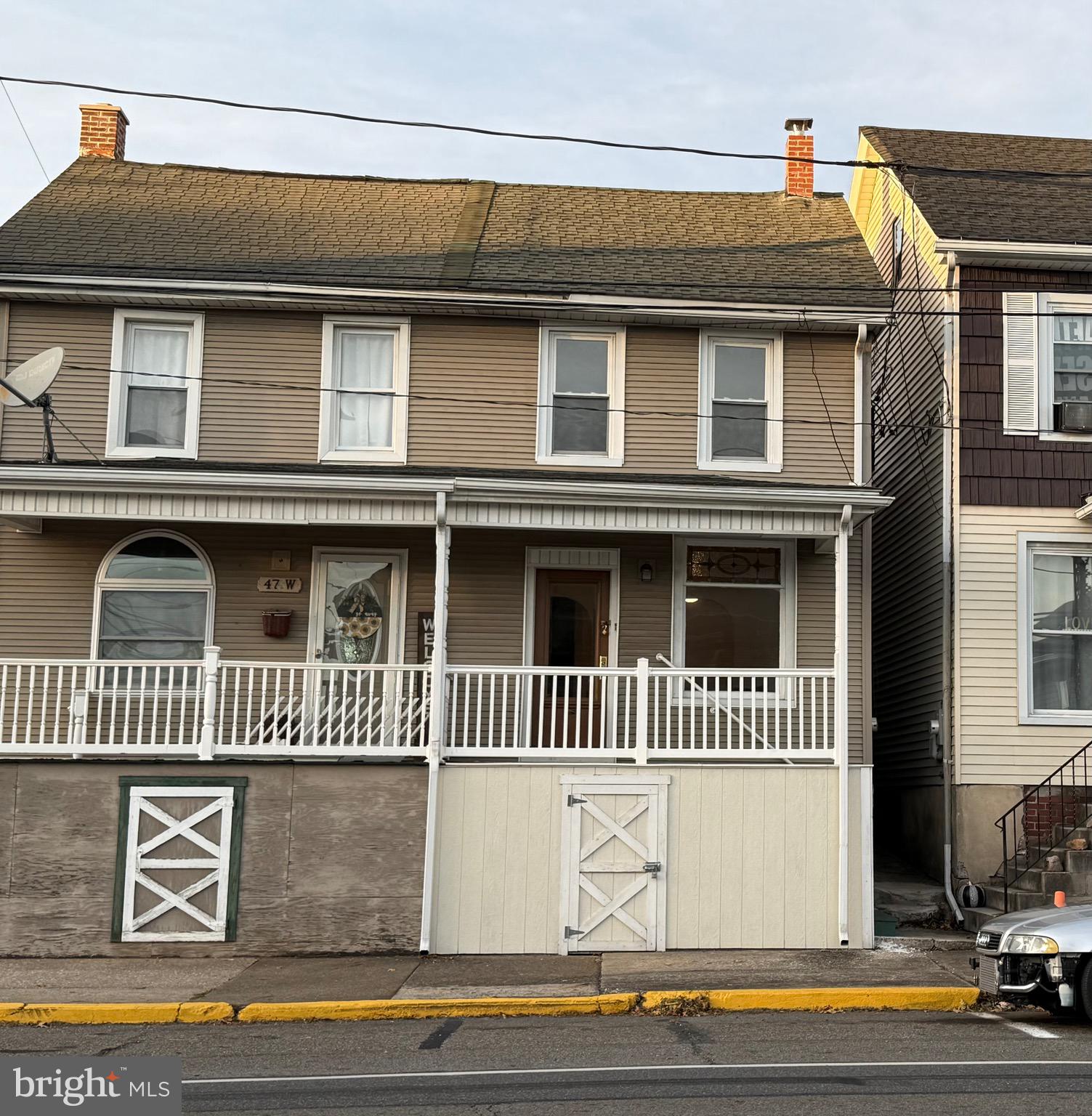 a front view of a house with a garage