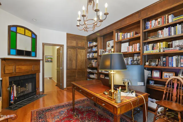a living room with furniture a bookshelf and a bookshelf