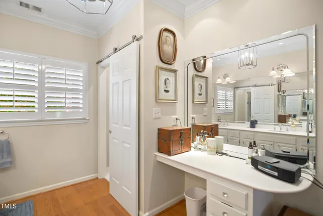 a bathroom with a sink double vanity and a mirror