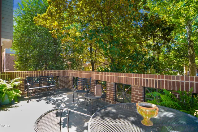 a view of balcony with wooden floor