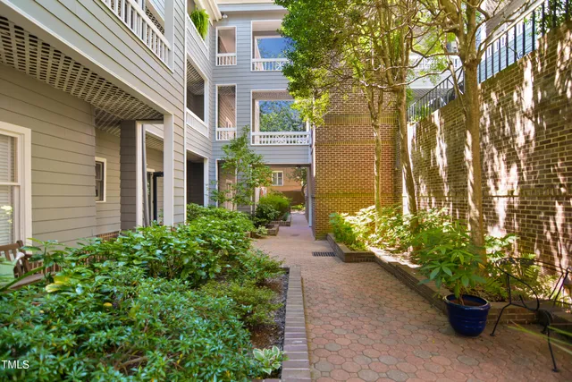 a view of a potted plants on a brick house