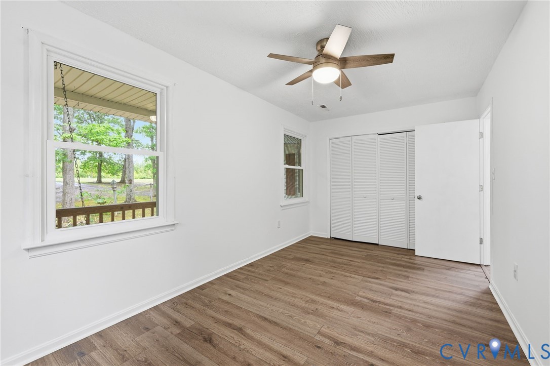 3220 Greenway Road Gladstone, VA 24553 - Photo 18 of 29 a view of an empty room with wooden floor and a window