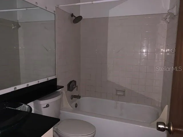 a bathroom with a toilet and a bathtub