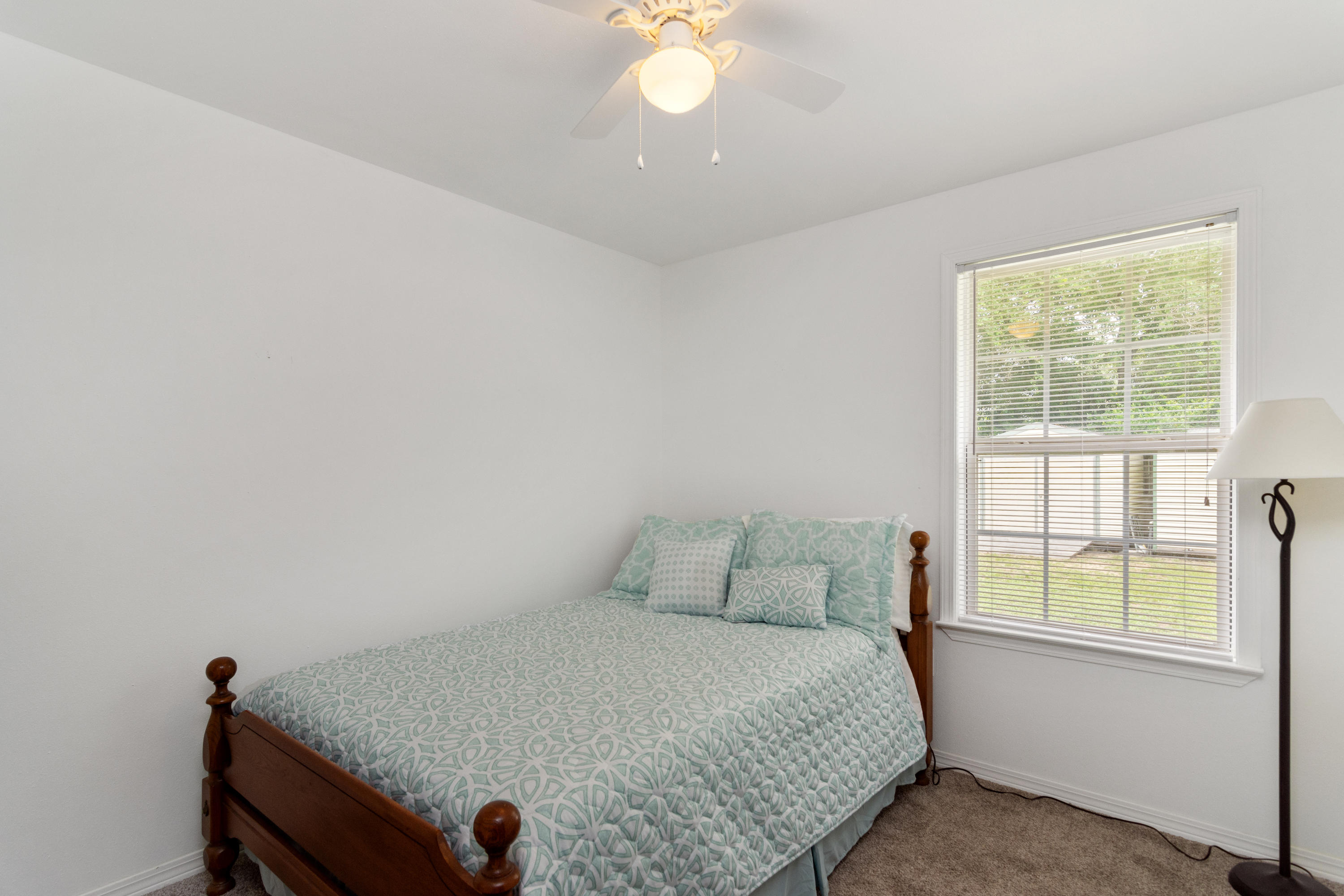 122 Springwood Circle Crestview, FL 32536 - Photo 17 of 27 a bedroom with a bed and a window