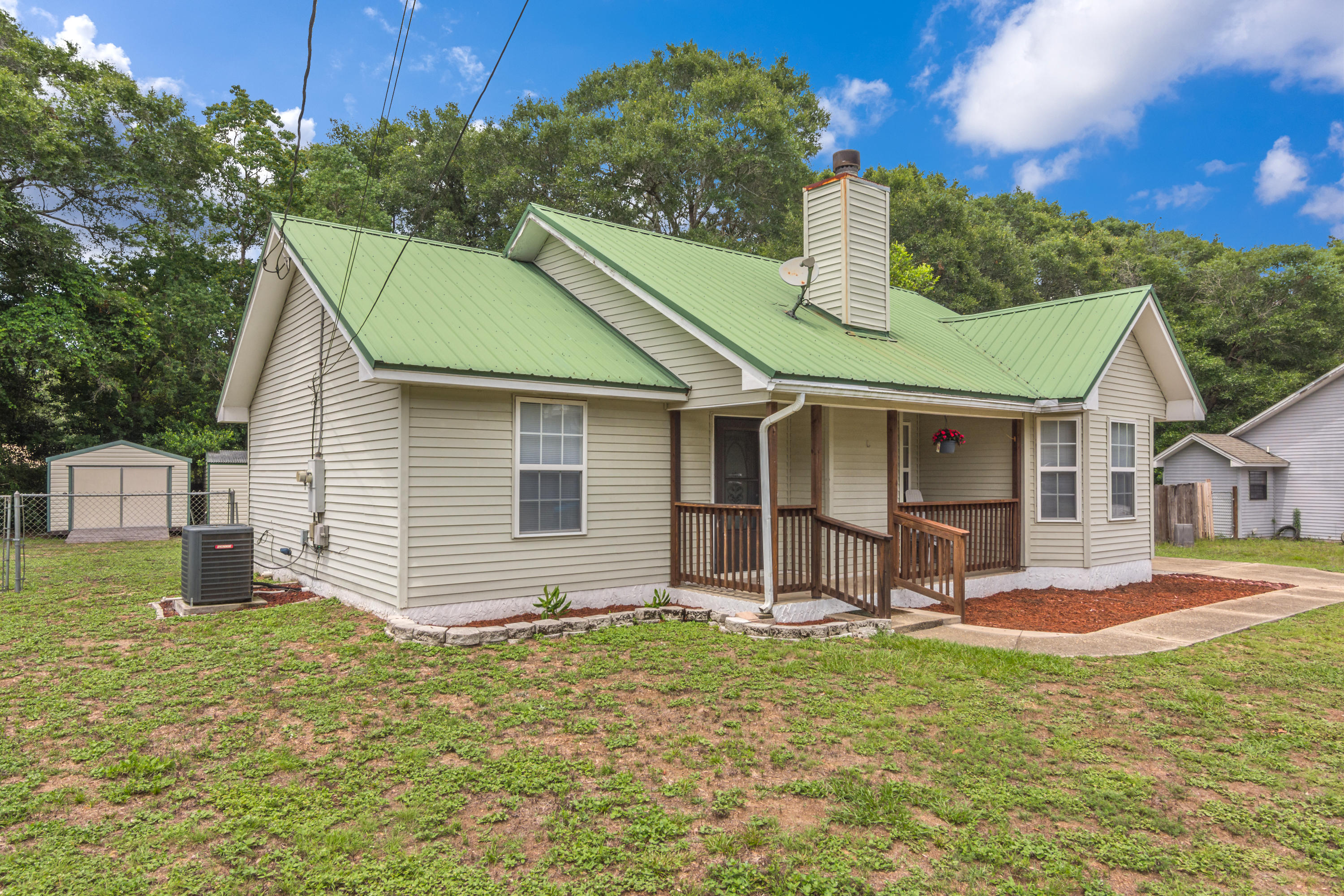 122 Springwood Circle Crestview, FL 32536 - Photo 3 of 27 a view of a house with a yard