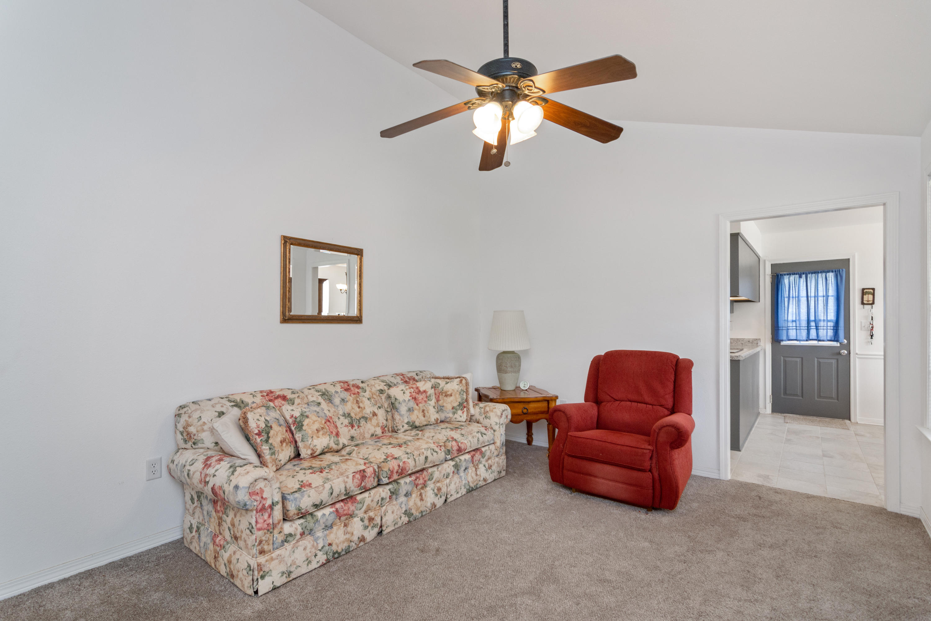 122 Springwood Circle Crestview, FL 32536 - Photo 4 of 27 a living room with furniture a couch and chandelier