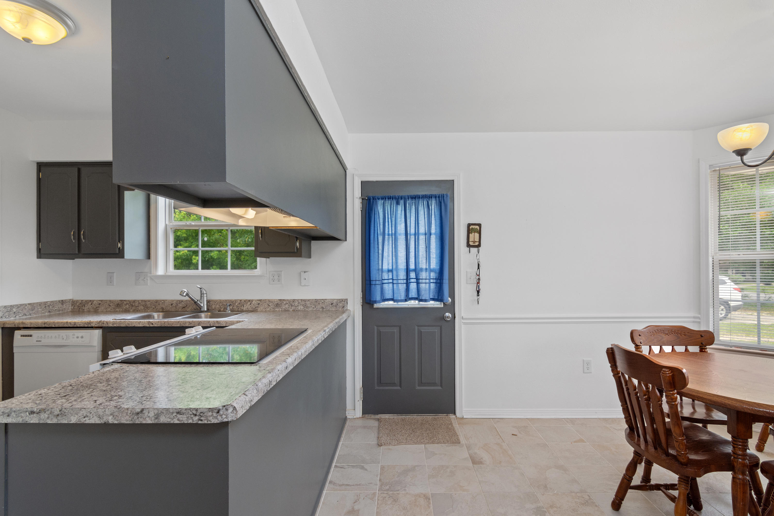 122 Springwood Circle Crestview, FL 32536 - Photo 7 of 27 a kitchen with a sink cabinets and counter space