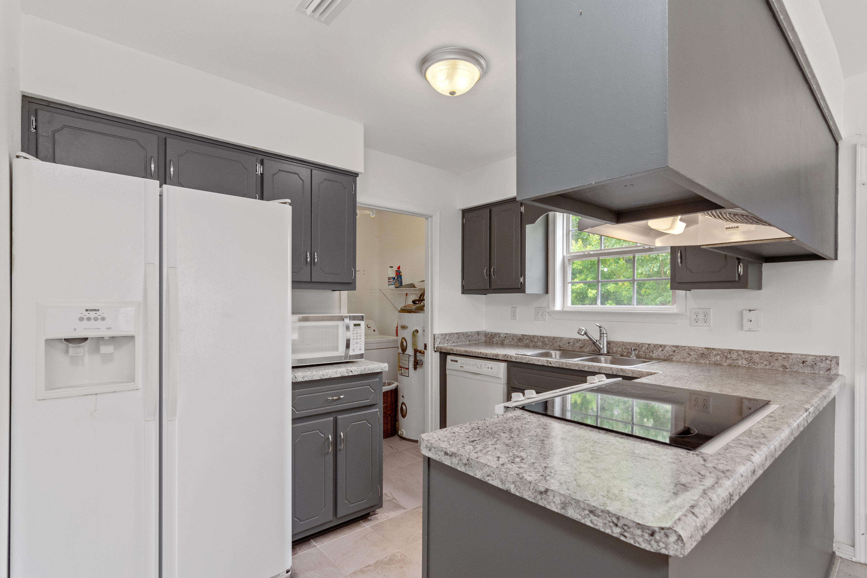 122 Springwood Circle Crestview, FL 32536 - Photo 8 of 27 a kitchen with stainless steel appliances granite countertop a sink stove and refrigerator