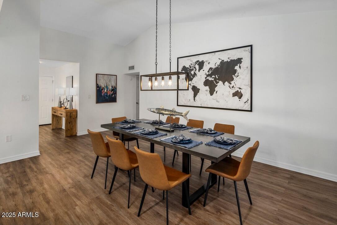 4526 East Paradise Lane Phoenix, AZ 85032 - Photo 15 of 48 a view of a dining room with furniture and wooden floor