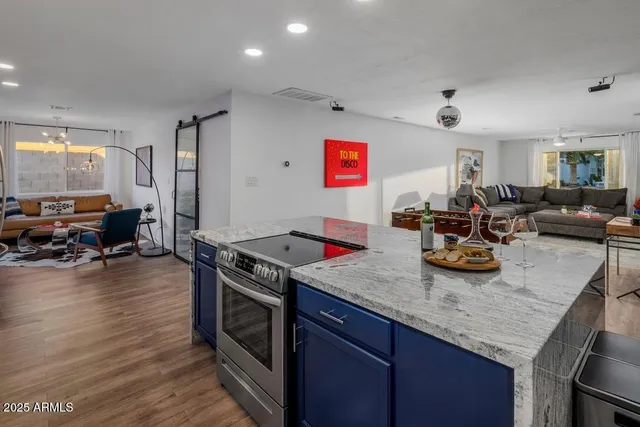 a kitchen with sink stove and cabinets