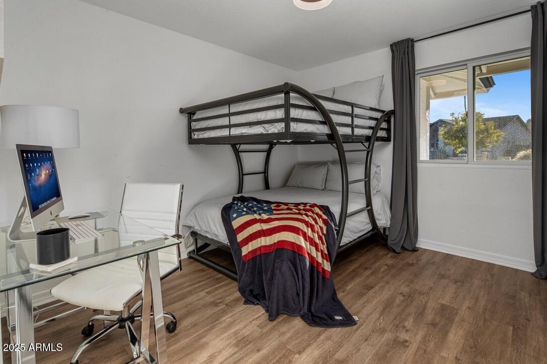 4526 East Paradise Lane Phoenix, AZ 85032 - Photo 30 of 48 a bedroom with a bed and a window