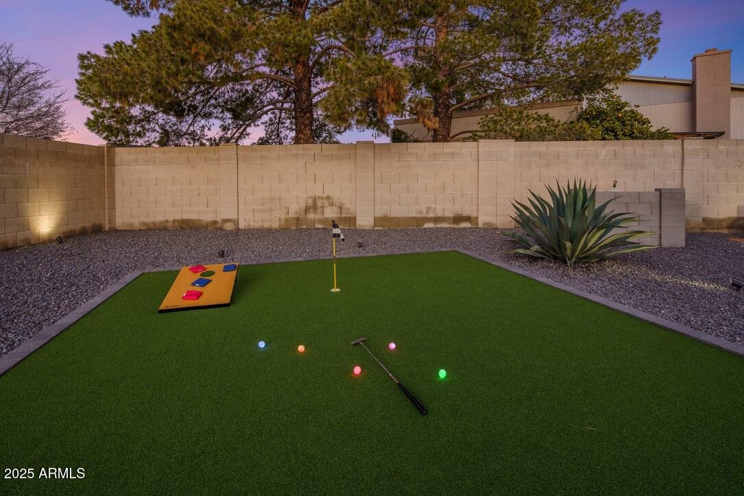 4526 East Paradise Lane Phoenix, AZ 85032 - Photo 43 of 48 a view of yard with swimming pool and trees in the background