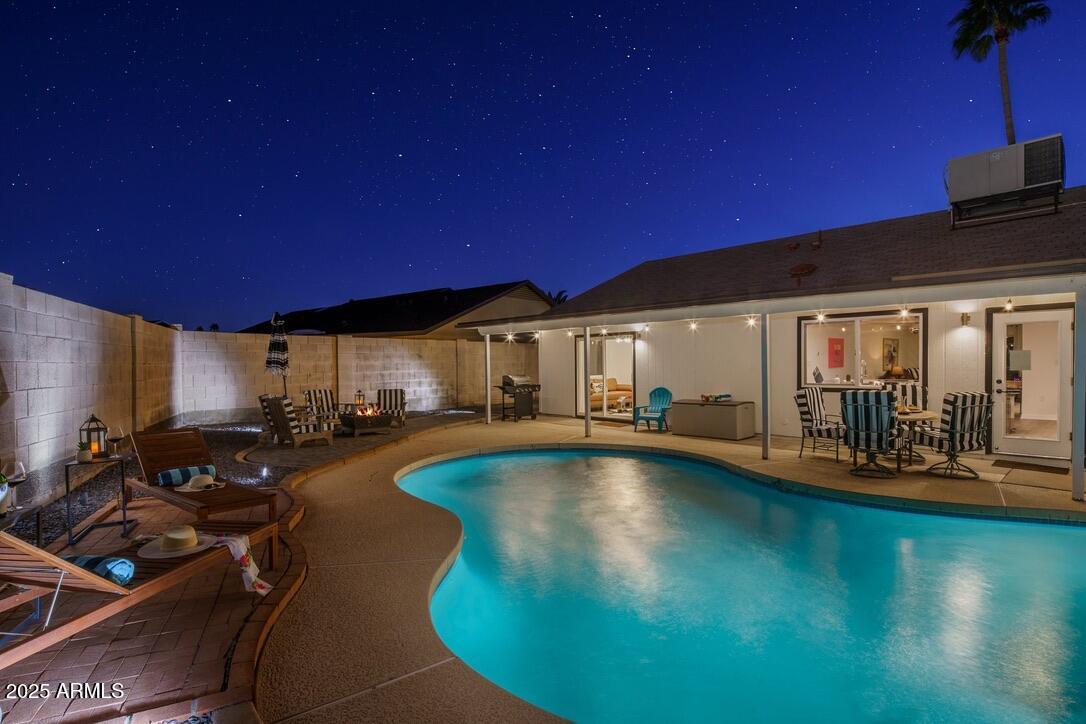 4526 East Paradise Lane Phoenix, AZ 85032 - Photo 44 of 48 a view of a swimming pool with outdoor seating