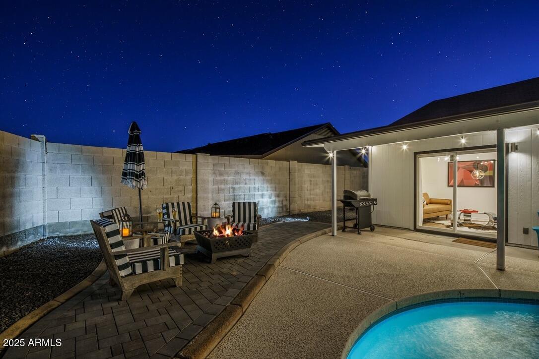 4526 East Paradise Lane Phoenix, AZ 85032 - Photo 45 of 48 a view of a patio with table and chairs and potted plants