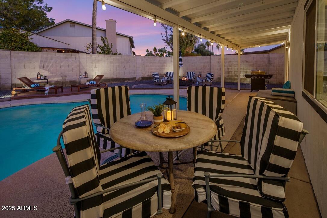 4526 East Paradise Lane Phoenix, AZ 85032 - Photo 47 of 48 a view of a chairs and table in patio
