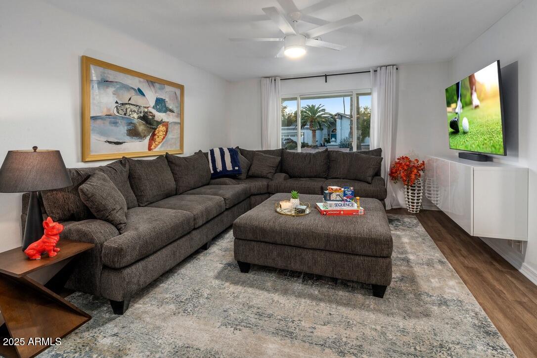 4526 East Paradise Lane Phoenix, AZ 85032 - Photo 5 of 48 a living room with furniture and a flat screen tv