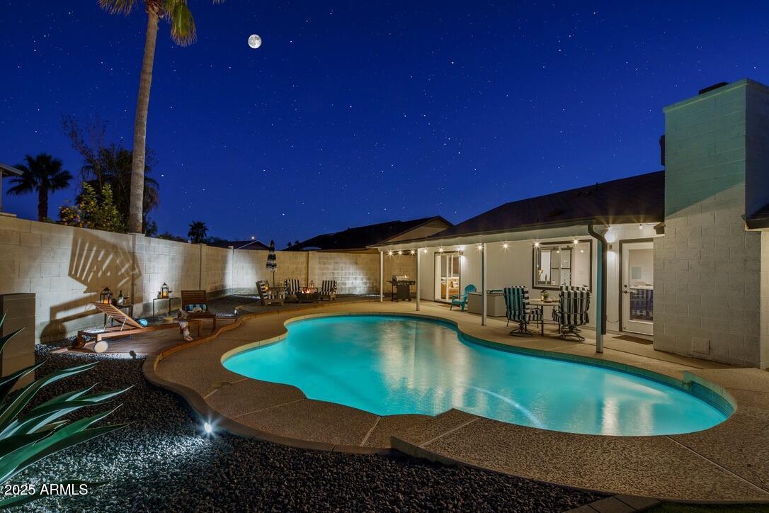 4526 East Paradise Lane Phoenix, AZ 85032 - Photo 6 of 48 a view of a swimming pool with chairs