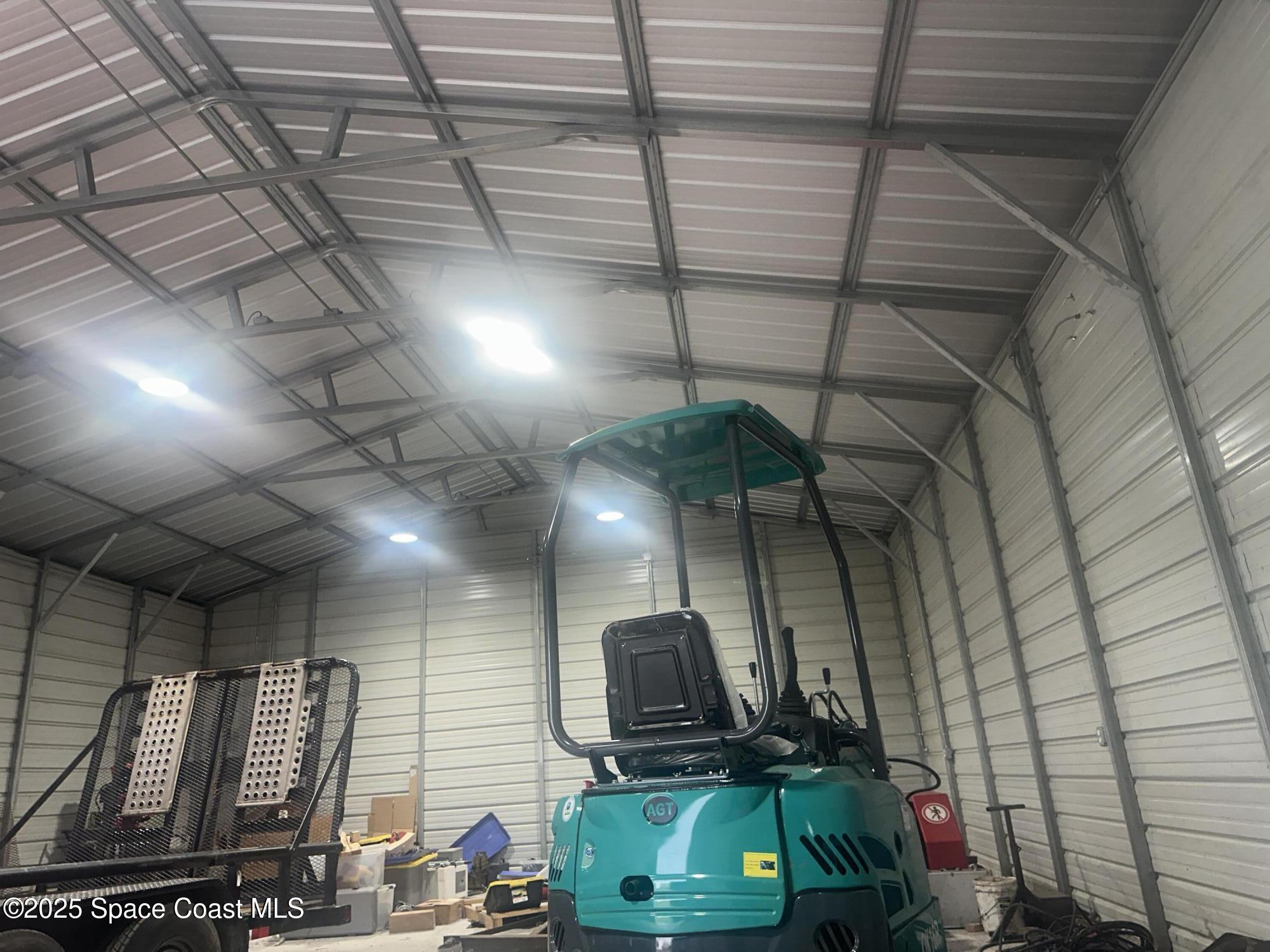 16124 Northwest 220th Street Okeechobee, FL 34972 - Photo 12 of 17 a room with lots of flowers and wooden cabinets