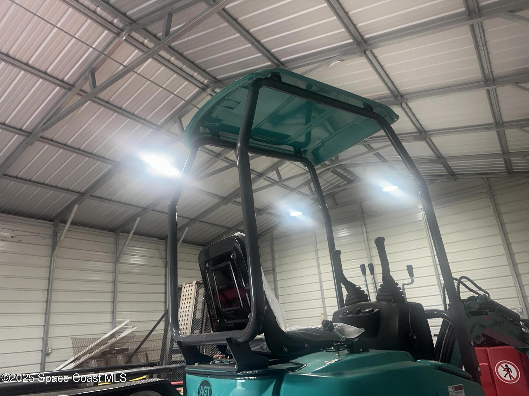 16124 Northwest 220th Street Okeechobee, FL 34972 - Photo 15 of 17 a view of a room with gym equipment