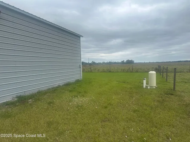 a view of a big yard of a house