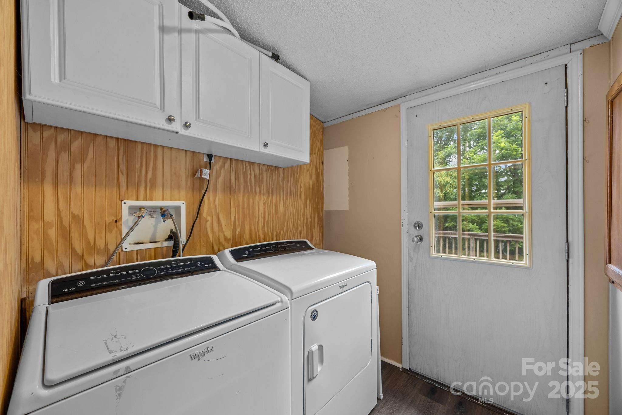 573 Deep Gap Loop Road Flat Rock, NC 28731 - Photo 11 of 20 a utility room with dryer and washer