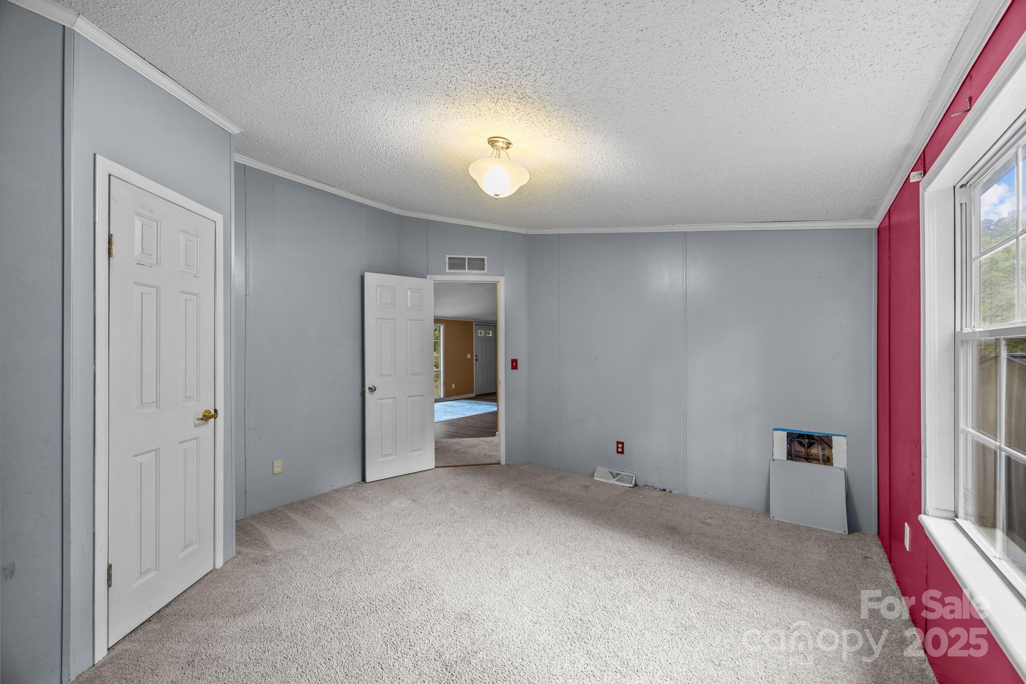 573 Deep Gap Loop Road Flat Rock, NC 28731 - Photo 14 of 20 a view of a livingroom with wooden furniture and windows