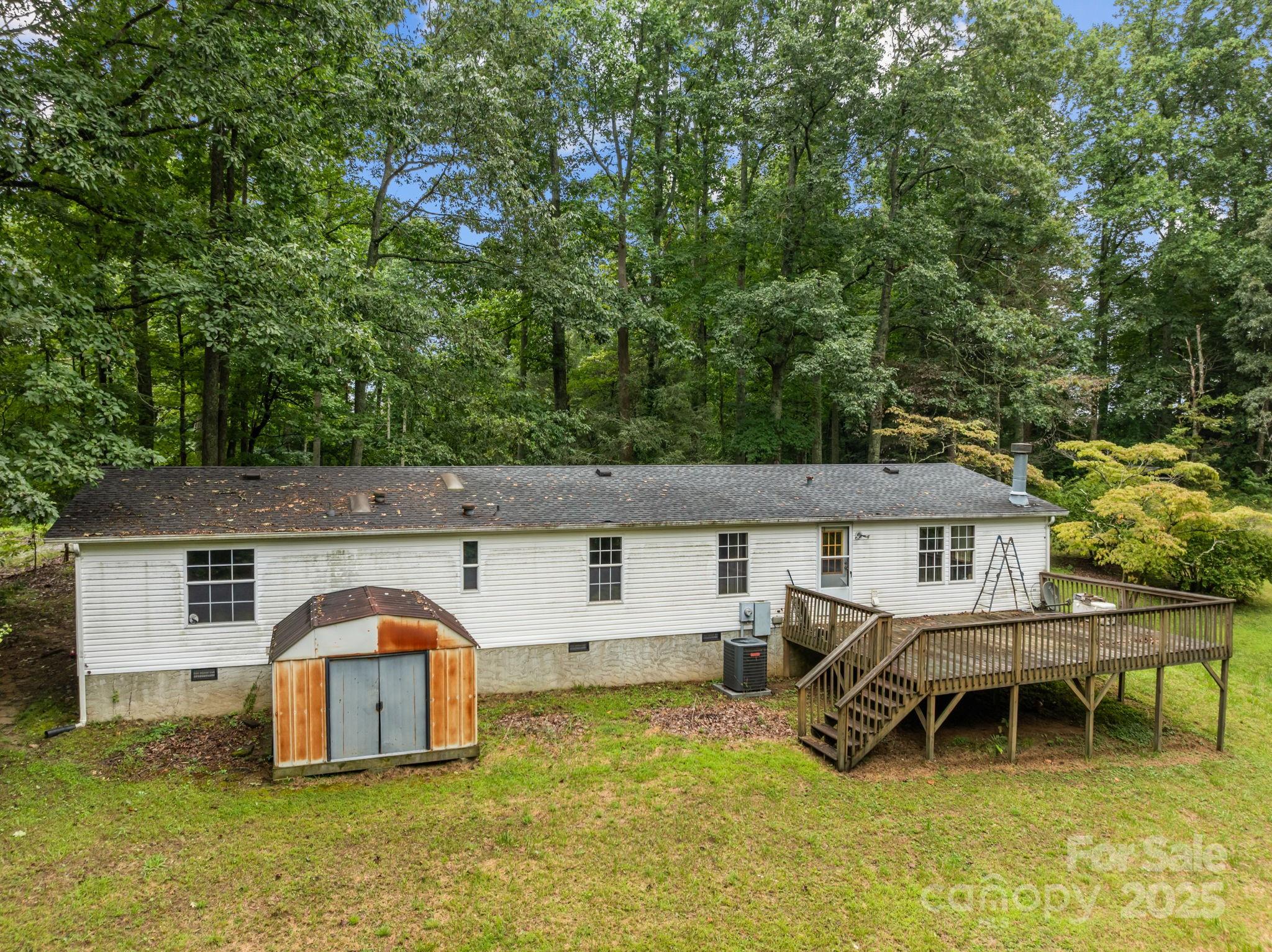 573 Deep Gap Loop Road Flat Rock, NC 28731 - Photo 18 of 20 a front view of a house with garden