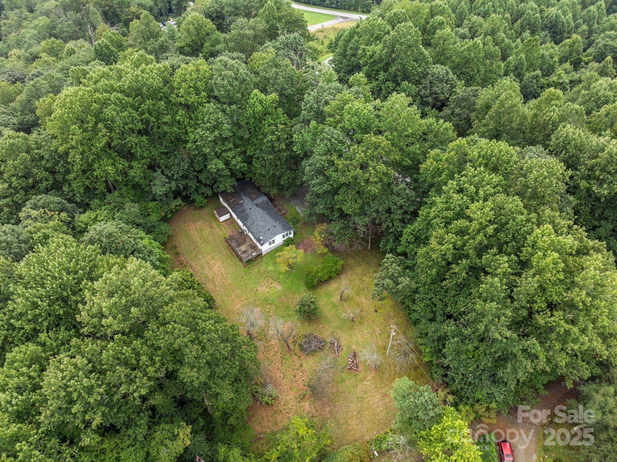 573 Deep Gap Loop Road Flat Rock, NC 28731 - Photo 20 of 20 an aerial view of residential house with outdoor space and trees all around