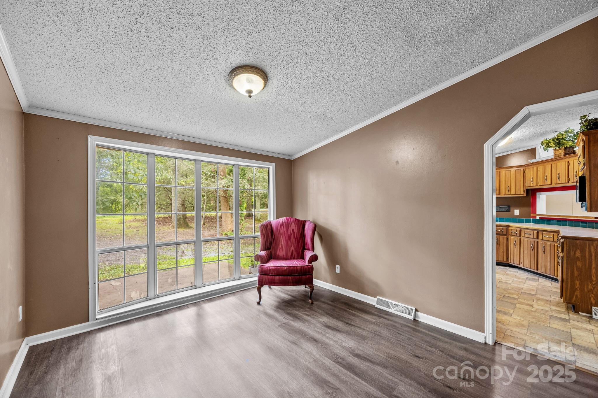 573 Deep Gap Loop Road Flat Rock, NC 28731 - Photo 7 of 20 a living room with furniture and wooden floor