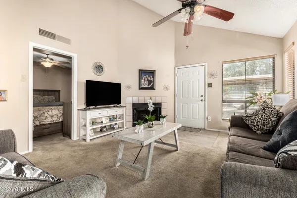 a living room with furniture and a flat screen tv