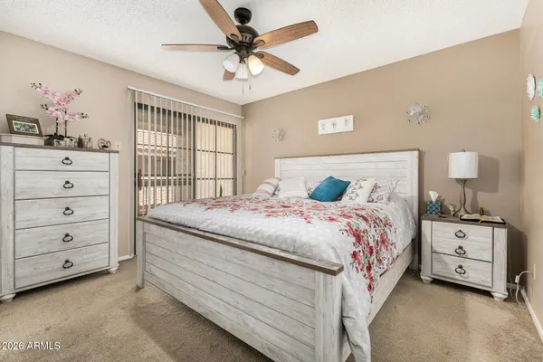 a bedroom with a bed and a dresser