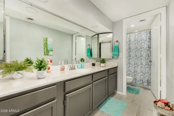 a bathroom with a sink and mirror
