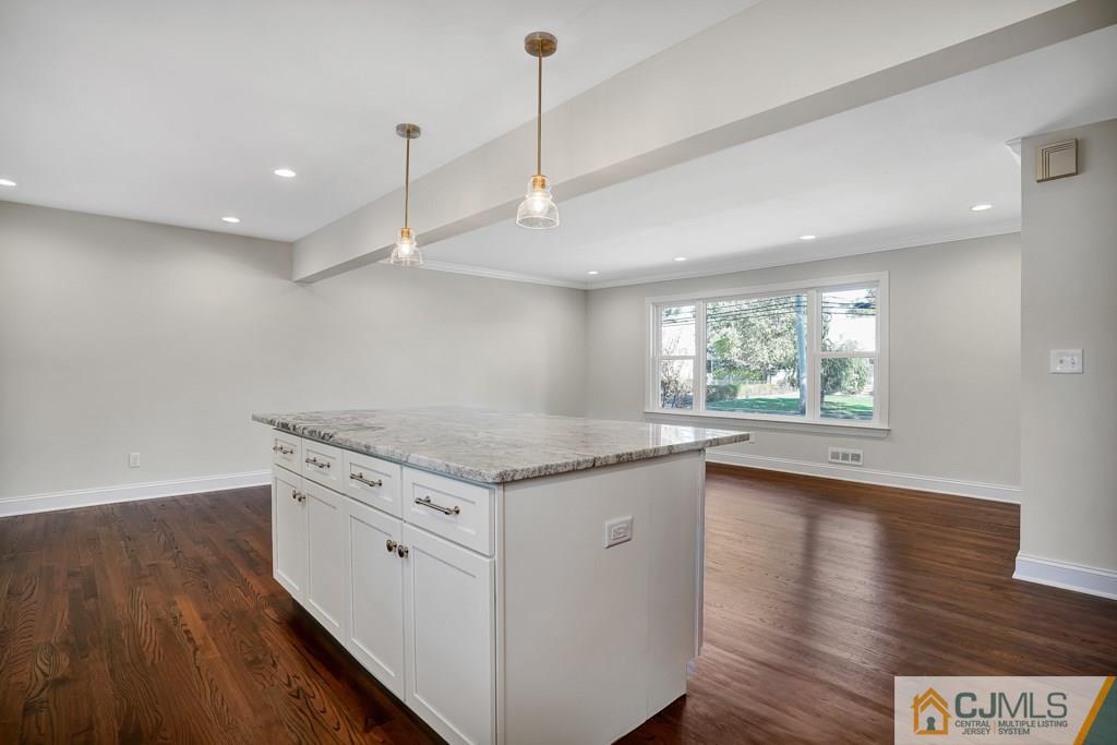 17 Greenbrook Road Middlesex, NJ 08846 - Photo 12 of 24 a kitchen with a stove a sink and wooden floor