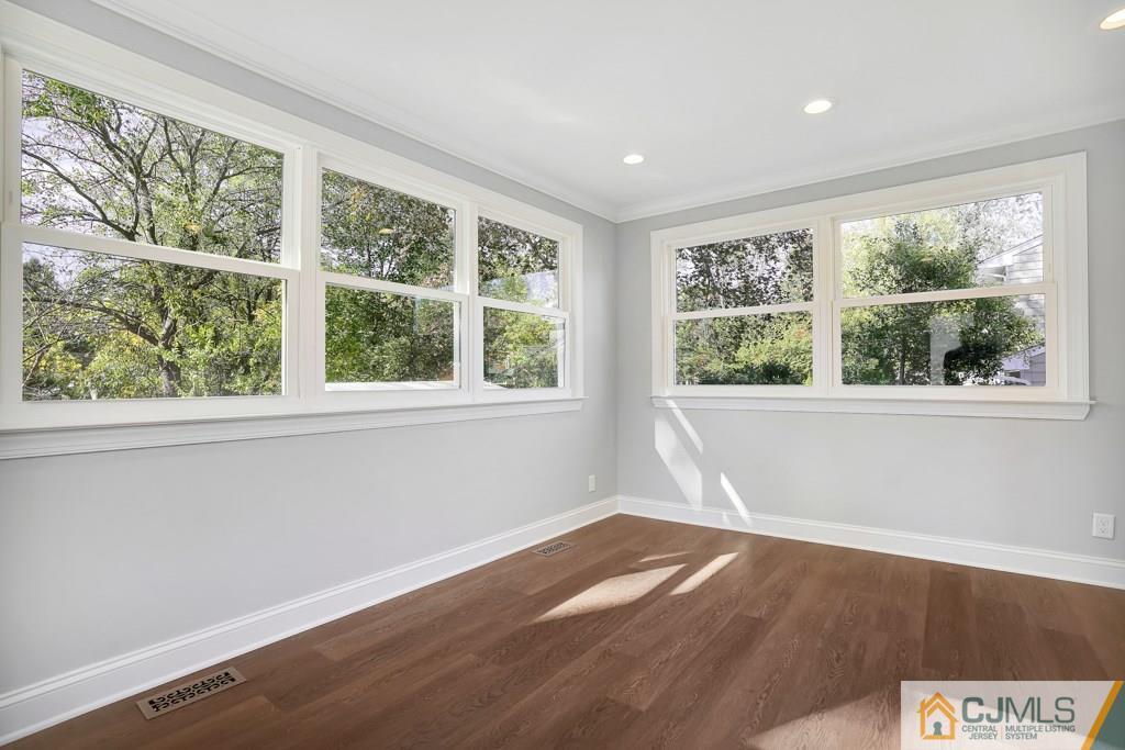 17 Greenbrook Road Middlesex, NJ 08846 - Photo 15 of 24 a view of empty room with wooden floor and fan