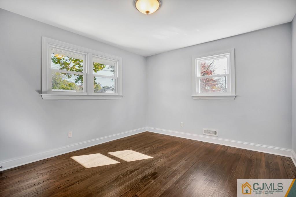 17 Greenbrook Road Middlesex, NJ 08846 - Photo 16 of 24 a view of empty room with wooden floor