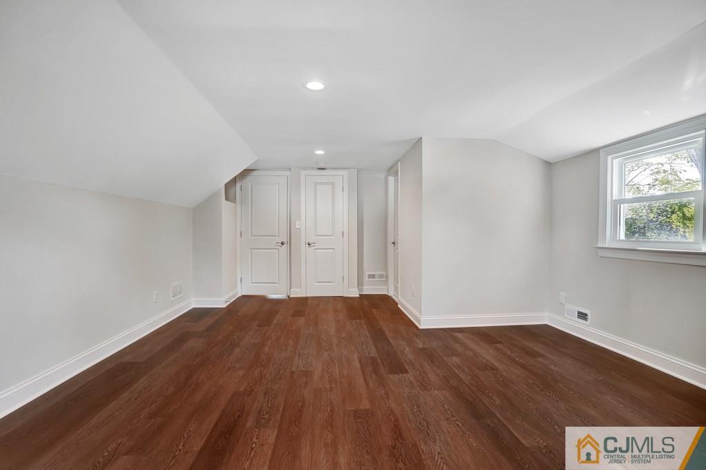 17 Greenbrook Road Middlesex, NJ 08846 - Photo 19 of 24 a view of empty room with wooden floor and fan