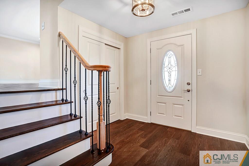 17 Greenbrook Road Middlesex, NJ 08846 - Photo 3 of 24 a view of a hallway with wooden floor