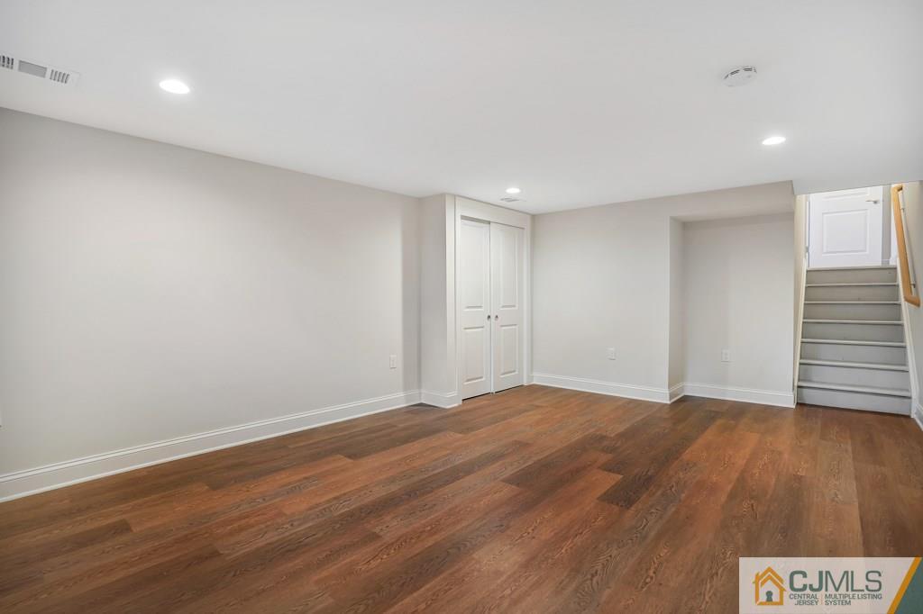 17 Greenbrook Road Middlesex, NJ 08846 - Photo 22 of 24 a view of an empty room with wooden floor and a window