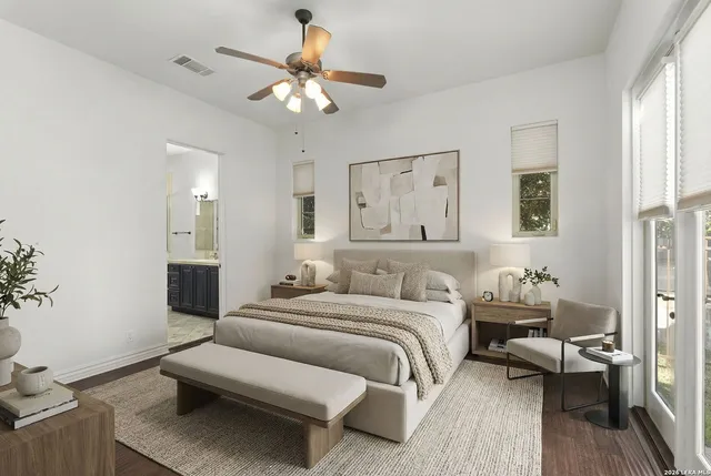 a spacious bathroom with a tub sink and mirror